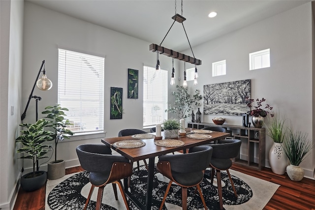 dining room featuring recessed lighting, baseboards, and wood finished floors