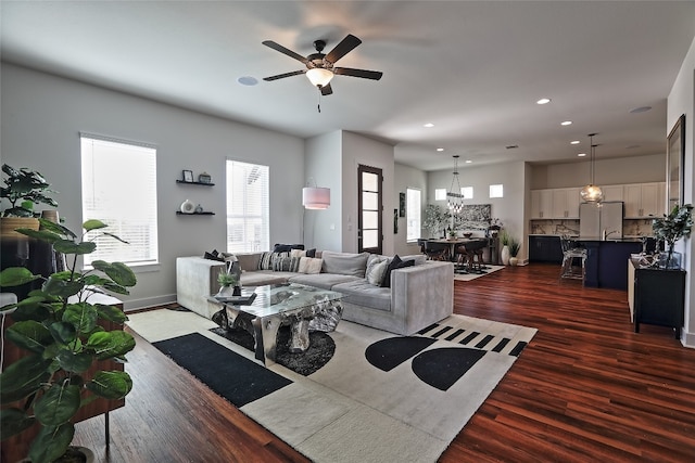 living area featuring dark wood finished floors, recessed lighting, and a ceiling fan