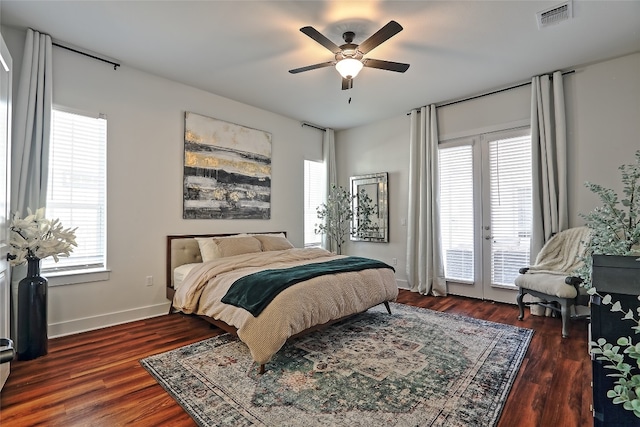 bedroom with access to exterior, visible vents, ceiling fan, baseboards, and wood finished floors