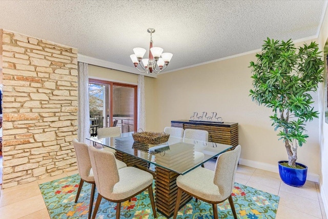 dining area with light tile patterned floors, baseboards, an inviting chandelier, ornamental molding, and a textured ceiling