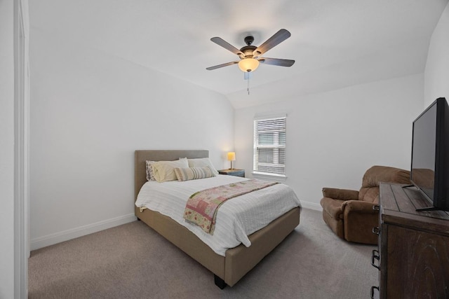 bedroom featuring lofted ceiling, carpet, baseboards, and ceiling fan