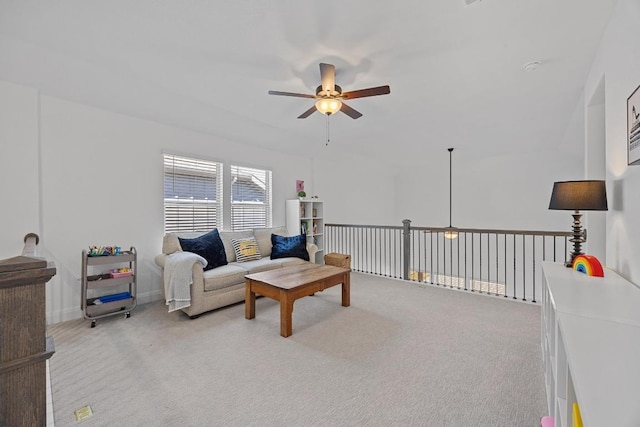 living room featuring light colored carpet and ceiling fan