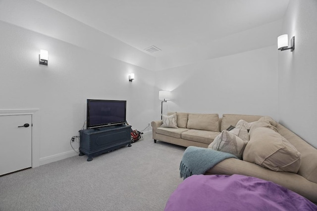 living area with carpet, visible vents, and baseboards