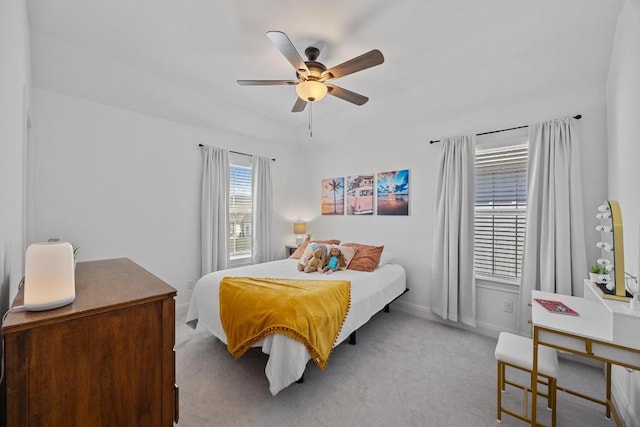 bedroom featuring ceiling fan, baseboards, and carpet floors