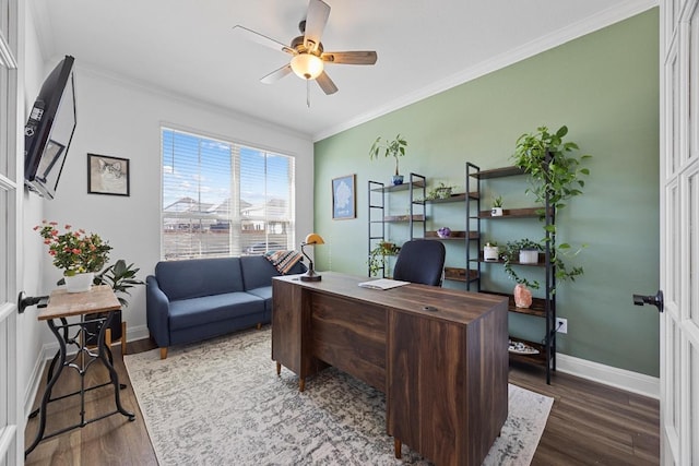 office space featuring a ceiling fan, crown molding, wood finished floors, and baseboards