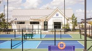 view of tennis court with fence