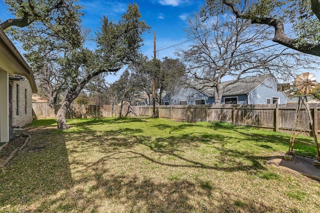 view of yard featuring a fenced backyard