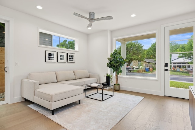 living room with plenty of natural light, recessed lighting, light wood-type flooring, and a ceiling fan