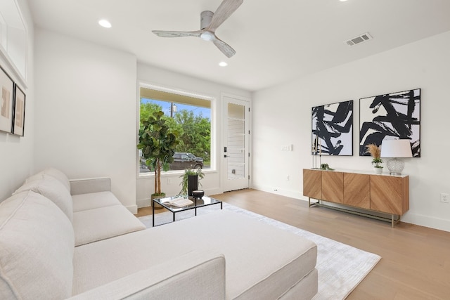 living room with recessed lighting, visible vents, wood finished floors, and ceiling fan