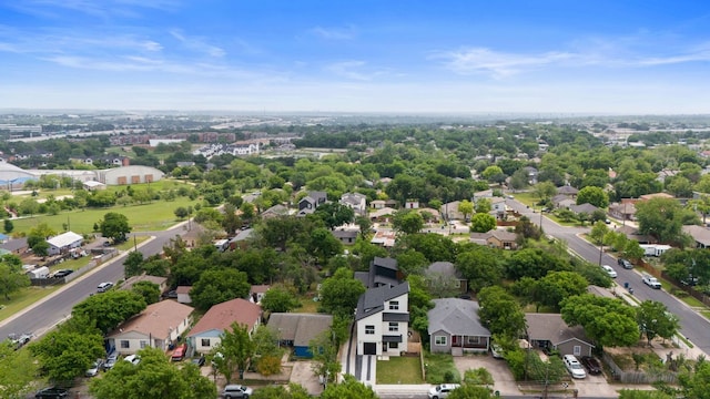 birds eye view of property with a residential view