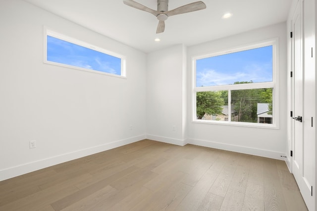 unfurnished room featuring a ceiling fan, recessed lighting, baseboards, and light wood finished floors