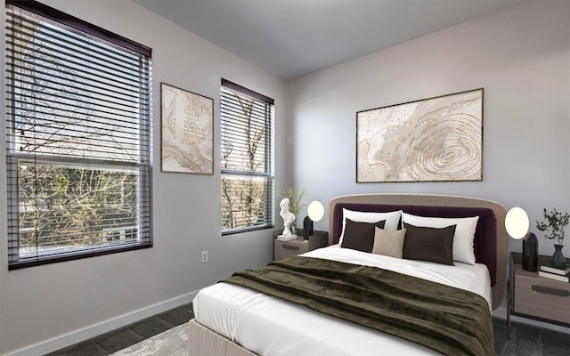 carpeted bedroom featuring baseboards