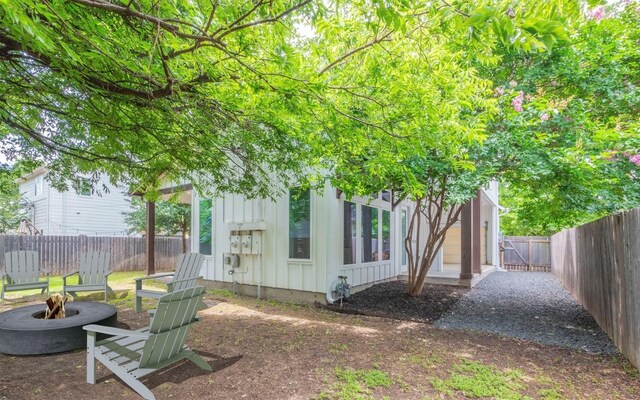 1128 Gunter St Unit B, Austin, TX 78702 - fenced backyard with an outdoor fire pit
