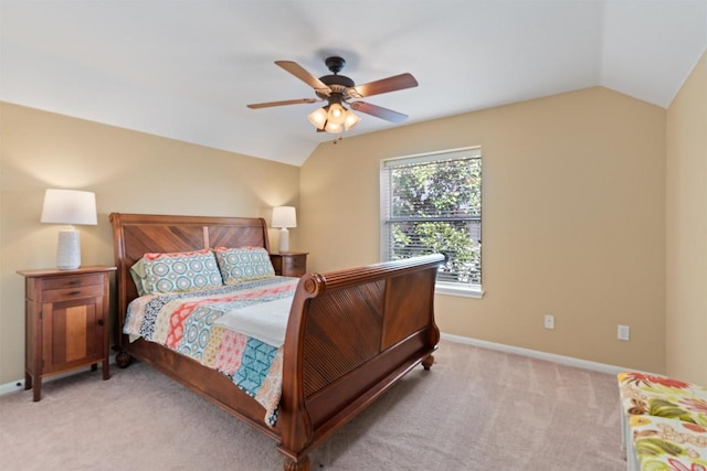 bedroom with vaulted ceiling, ceiling fan, baseboards, and carpet floors