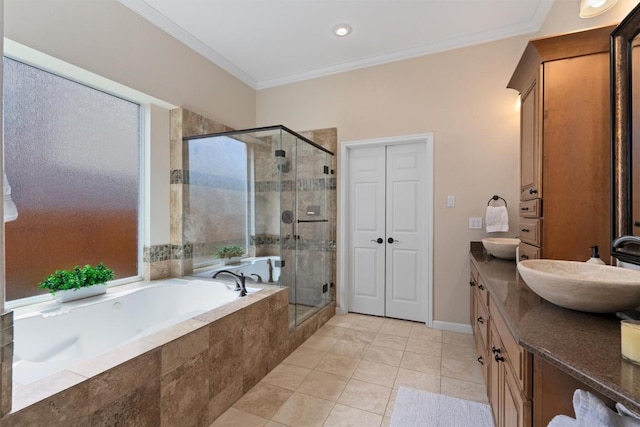 full bathroom with vanity, a garden tub, a stall shower, and ornamental molding