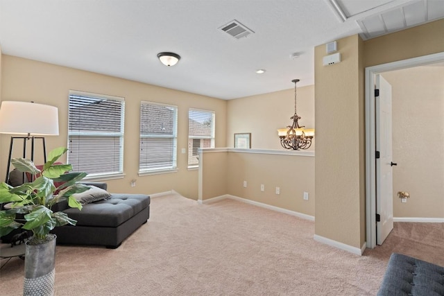 sitting room featuring an inviting chandelier, carpet, visible vents, and baseboards