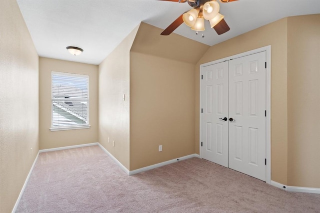 unfurnished bedroom with a closet, baseboards, and carpet floors