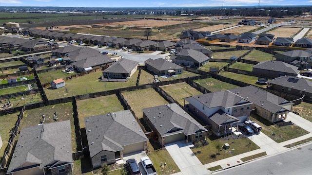 birds eye view of property with a residential view