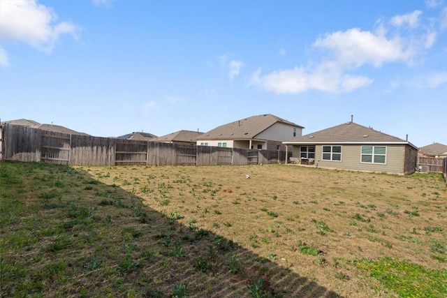 view of yard featuring a fenced backyard