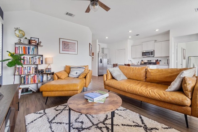 living room featuring visible vents, a ceiling fan, wood finished floors, recessed lighting, and vaulted ceiling