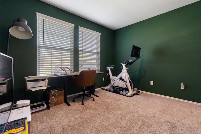 carpeted office space with baseboards