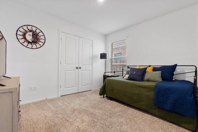 carpeted bedroom with a closet