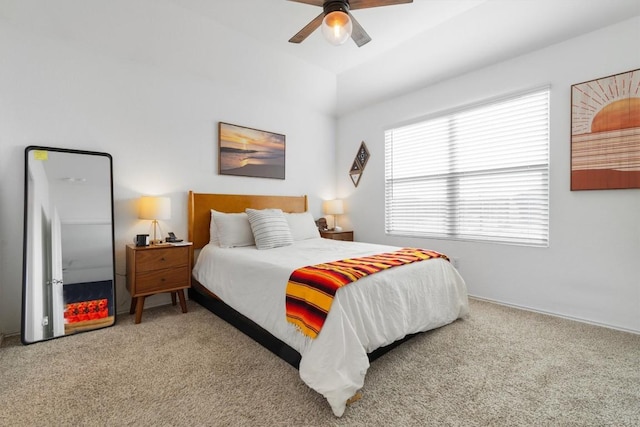 carpeted bedroom featuring ceiling fan