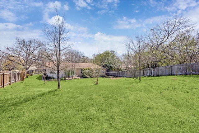 view of yard with a fenced backyard