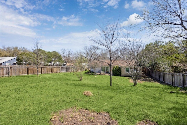 view of yard featuring a fenced backyard