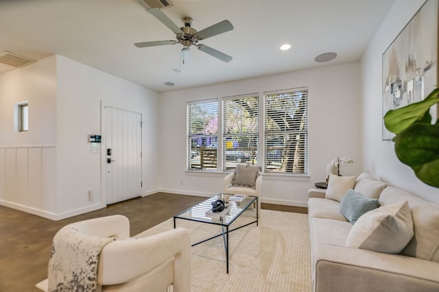 living area with recessed lighting, visible vents, ceiling fan, and baseboards