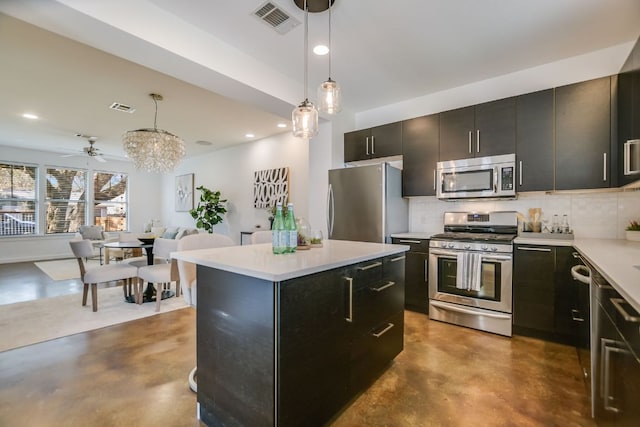 kitchen featuring light countertops, visible vents, appliances with stainless steel finishes, and finished concrete floors