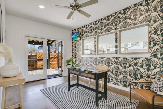 interior space featuring wallpapered walls, finished concrete flooring, recessed lighting, and a ceiling fan