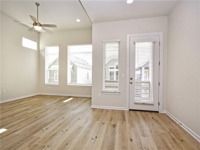 interior space with recessed lighting, baseboards, ceiling fan, and wood finished floors