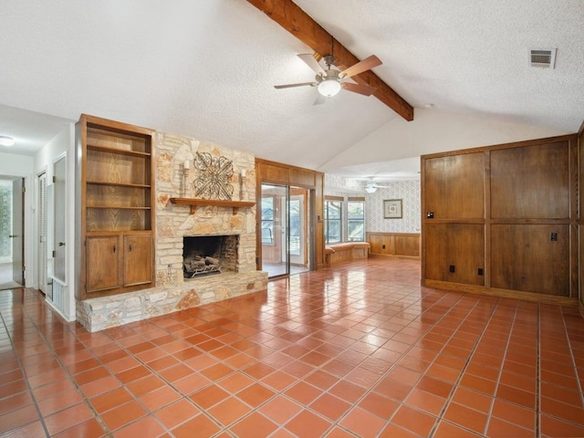 unfurnished living room with built in shelves, a ceiling fan, lofted ceiling with beams, tile patterned flooring, and a textured ceiling