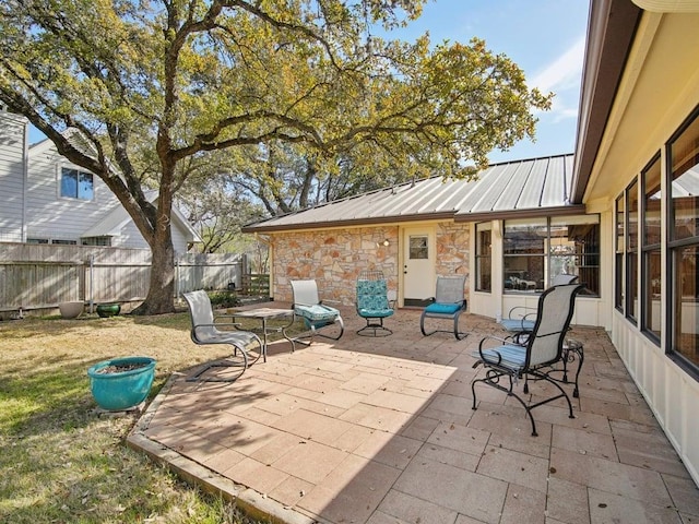 view of patio / terrace featuring fence