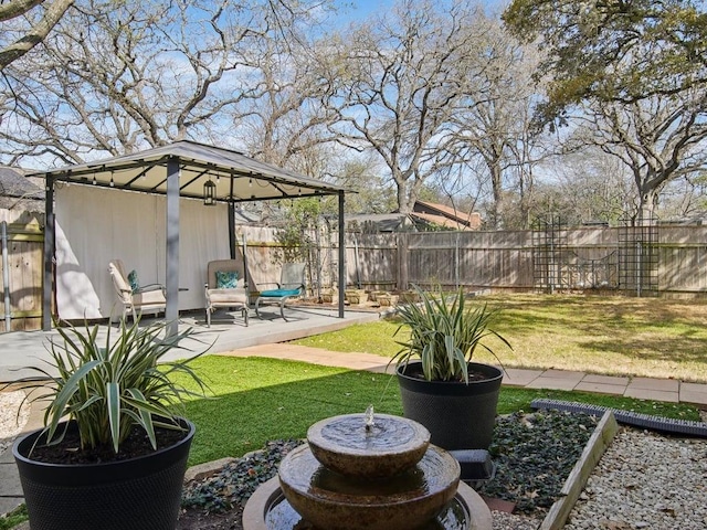 view of yard featuring a gazebo, a patio area, and fence