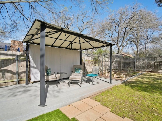 view of patio featuring a gazebo and a fenced backyard