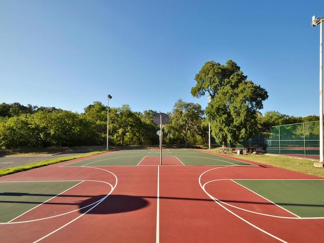 view of sport court featuring community basketball court and fence