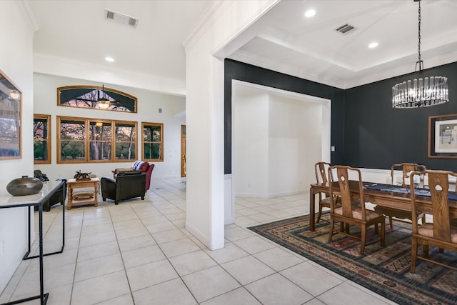 dining space featuring visible vents, ornamental molding, and a chandelier