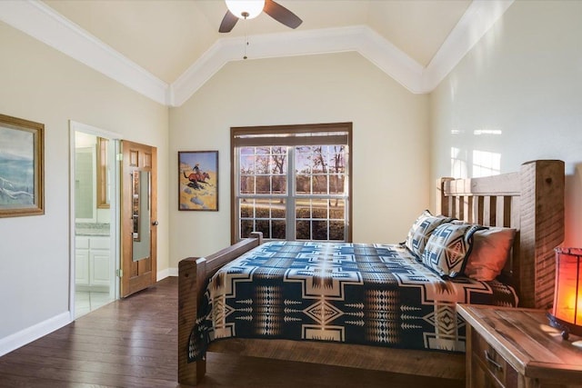 bedroom featuring hardwood / wood-style floors, baseboards, ornamental molding, vaulted ceiling, and connected bathroom