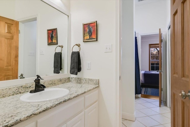 bathroom with tile patterned floors and vanity