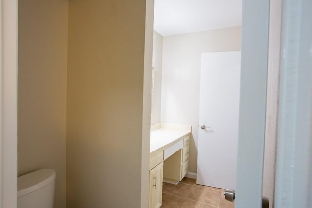 bathroom featuring tile patterned floors, toilet, and vanity