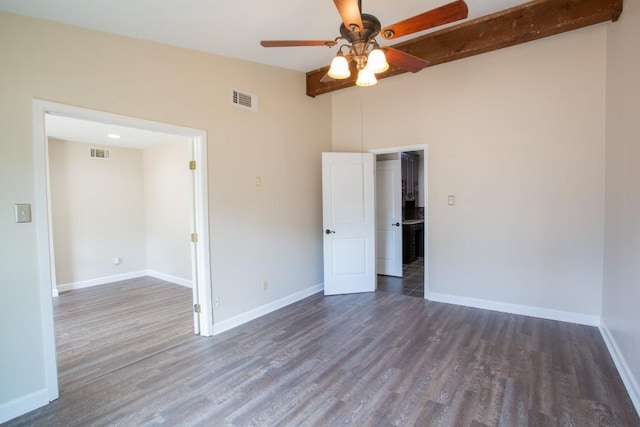 unfurnished room with visible vents, baseboards, ceiling fan, and dark wood-style flooring