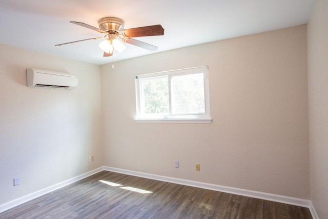 empty room with a wall mounted air conditioner, baseboards, dark wood-type flooring, and a ceiling fan