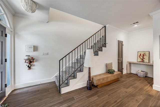 foyer entrance featuring visible vents, dark wood-style floors, stairway, crown molding, and baseboards