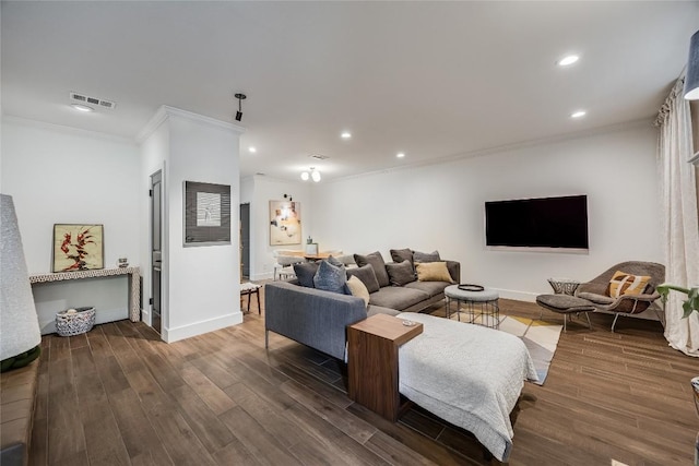 living room featuring visible vents, ornamental molding, wood finished floors, recessed lighting, and baseboards