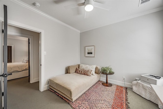 carpeted bedroom with visible vents, a ceiling fan, crown molding, and baseboards