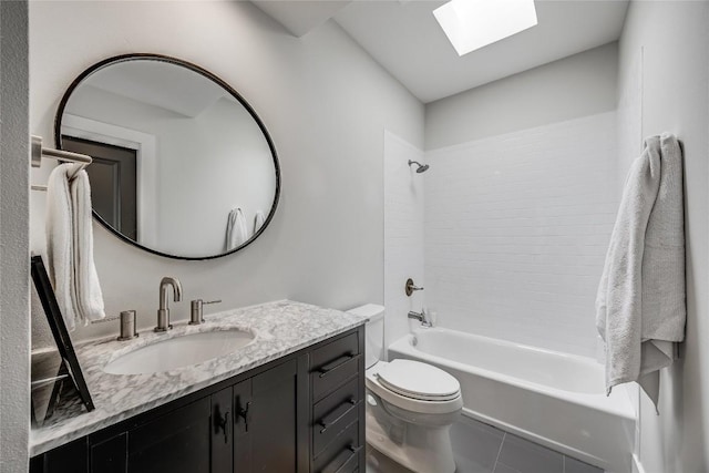 full bathroom with toilet, a skylight, tile patterned floors, vanity, and  shower combination