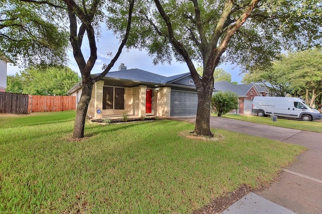 single story home with driveway, fence, a front yard, an attached garage, and a chimney