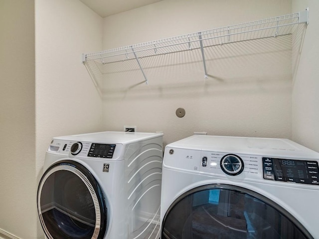 laundry area featuring laundry area and washer and clothes dryer